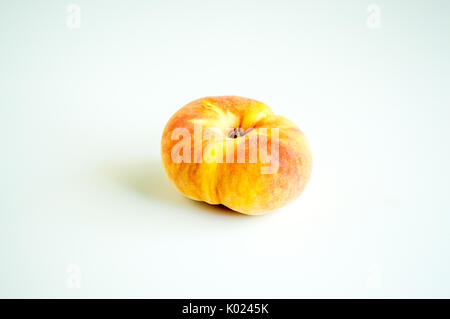 solitary donut peach isolated on white Stock Photo