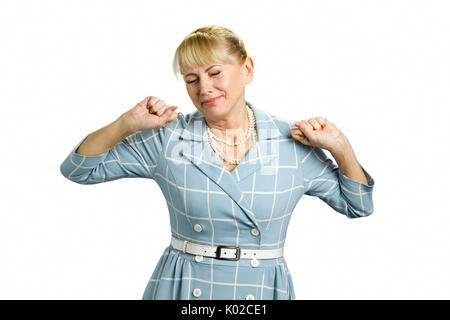 Stretching sleepy mature woman. Beautiful tired fatigued woman stretching extending arms, back, shoulders isolated on white background. Stock Photo
