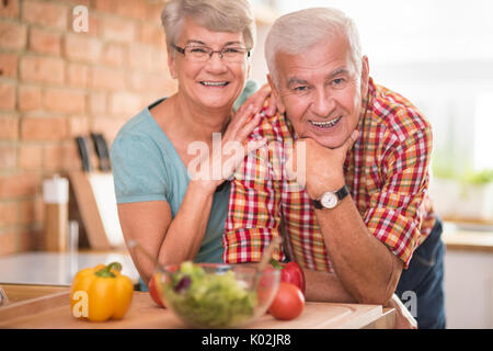 Portrait of cheerful marriage at the domestic kitchen Stock Photo
