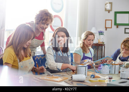 Female artists painting in art class workshop Stock Photo