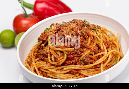 Close up shot of Spaghetti with minced beef and tomato sauce Isolated on white background Stock Photo