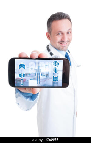Male doctor using tablet with medical interface to monitor and record a patient disease Stock Photo