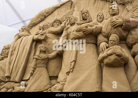 Sand sculpture nativity scene depicting a pregnant Mary with Joseph and ...