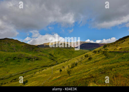 Snowdonia, Wales August 2017.  Mountain view captured in light HDR. Snowdon mountain area with roads and houses nearby covered in summer light weather Stock Photo