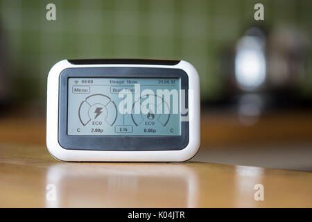 Domestic Energy Smart Meter on a Kitchen Worktop Displaying Electricity and Gas Usage in Real Time Stock Photo