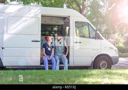 MEET the married medics who are working and travelling around America in the back of their refurbished van to pay off their student loans. Incredible  Stock Photo