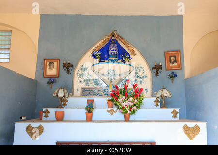 Small Santeria religion altar in a building in Regla, Havana, Cuba Stock Photo
