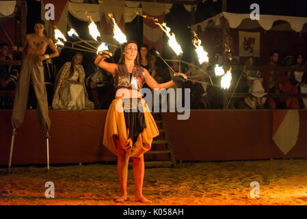 Alburquerque, Spain - august 19, 2017. Female fire show performer at night participing in festival medieval in Alburquerque Stock Photo