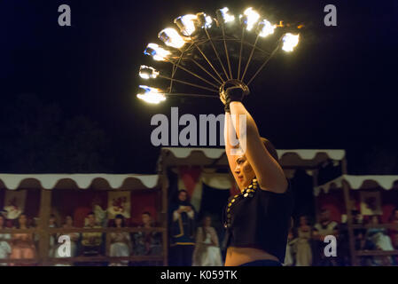 Alburquerque, Spain - august 19, 2017. Female fire show performer at night participing in festival medieval in Alburquerque Stock Photo