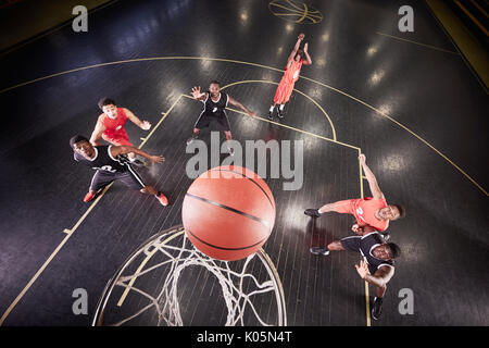 Overhead view young male basketball player shooting free throw in basketball game