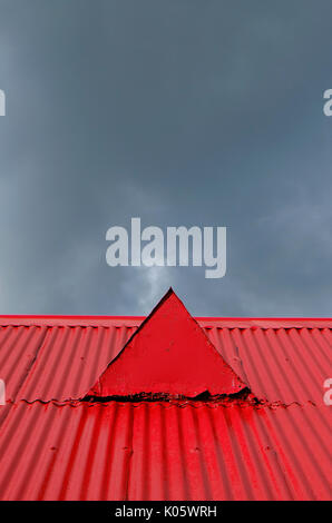 red painted corrugated metal roof on old chapel building Stock Photo