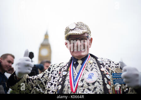 London, England, UK. 21 August, 2017. George Major, Pearly King of Peckham joins crowds and the world’s media to witness the last chimes of Big Ben at 12 noon before it is silenced for restoration to Elizabeth Tower for four years. Credit: Michael Goldrei/Alamy Live News. Stock Photo