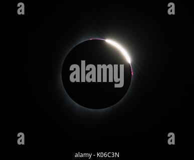 Madras, United States Of America. 21st Aug, 2017. Some prominences are seen as the moon moves over the sun during the total solar eclipse August 21, 2017 in Madras, Oregon. The total eclipse swept across a narrow portion of the contiguous United States from Oregon to South Carolina and a partial solar eclipse was visible across the entire North American continent along with parts of South America, Africa, and Europe. Credit: Planetpix/Alamy Live News Stock Photo