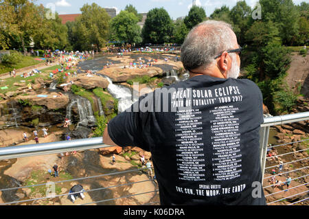 Greenville, United States. 21st Aug, 2017. August 21, 2017- Greenville, South Carolina, United States - A man wears an eclipse t-shirt in Falls Park in Greenville, South Carolina where hundreds of people gathered on August 21, 2017 to view the total solar eclipse. Credit: Paul Hennessy/Alamy Live News Stock Photo