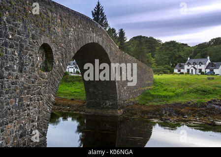 Clachan Bridge / Bridge over the Atlantic, single-arched, hump-backed masonry bridge spanning the Clachan Sound, Argyll, Scotland, UK Stock Photo