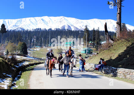 Cowboys riding on their horses at Gulmarg, India. Majestic, adventure. Stock Photo