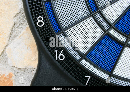 Bullseye on a wall with some darts Stock Photo
