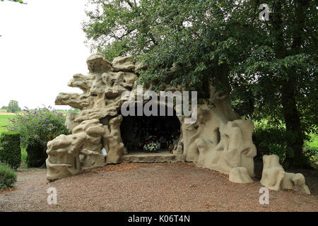 Replica of the Lourdes Grotto in Rue de la Grotte, Vron, Somme, Hauts de France, France Stock Photo