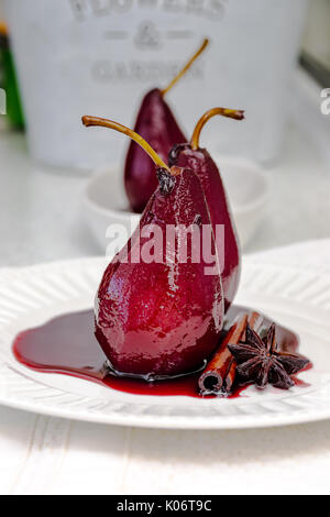 Pears poached in red wine, with star anise Stock Photo