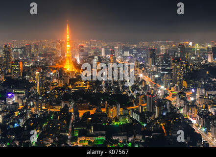 Aerial view of Tokyo with Tokyo Tower at night. Tokyo mixes the ultramodern and the traditional, from neon-lit skyscrapers to historic temples. Stock Photo