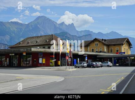 View of the Sargans train station (Sargans Bahnhof) with the Alps in the background where trains stop from Zurich Stock Photo