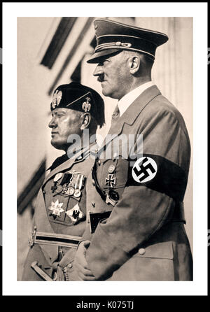 1940 GERMAN PROPAGANDA WW2 Adolf Hitler and Benito Mussolini take a troop parade salute in Munich in 1940 Stock Photo