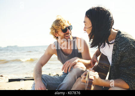 Singing on the beach Stock Photo