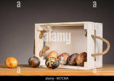 Multicolored hand painted easter eggs in the wooden box Stock Photo