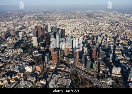 Los Angeles, California, USA - August 7, 2017:  Afternoon aerial view of urban downtown towers and streets along the Harbor 100 freeway. Stock Photo