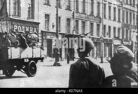 Armed soldiers riding in a  truck, Russian Revolution Stock Photo