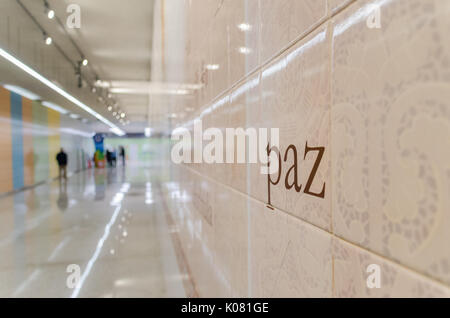 The word 'paz' meaning peace in Portuguese is written on the wall to the entrance of a metro station in Rio de Janeiro, Brazil Stock Photo