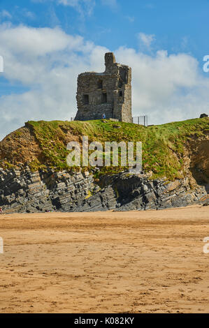 Sandy beach and rocky coastline at low tide in the evening sun, Long ...