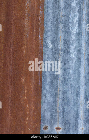 Red and silver retro aluminum siding on a barn Stock Photo