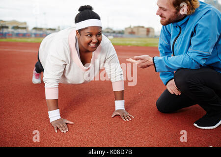 Doing push-ups Stock Photo