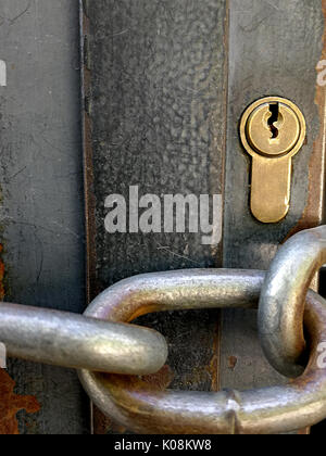 Key and chain closing door Stock Photo