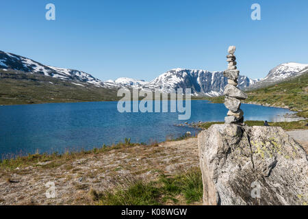 The famous road in Norway also called road 51 or the bygdin vegen near Bismo with stack of stones Stock Photo