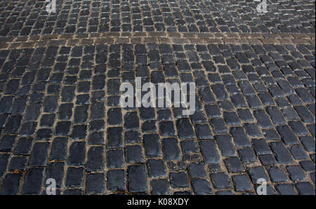 Urban stone paving stones. Texture, side view. Stock Photo