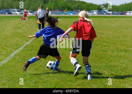 Two youth soccer players in action Stock Photo