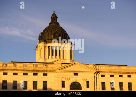 The moon shines behind the capitol dome in Pierre, SD Stock Photo