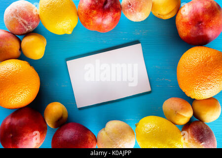 Fresh fruits on a blue wooden table Stock Photo