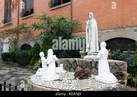 New York, USA - September 27, 2016: Holy statues outside the Church of St. Anthony of Padua, a Catholic parish church in the Roman Catholic Archdioces Stock Photo