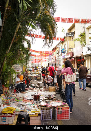 Melaka, Malaysia - Feb 9, 2014. Selling antique at street market in Chinatown, Melaka, Malaysia. Melaka (Malacca) is one of the most popular tourist d Stock Photo