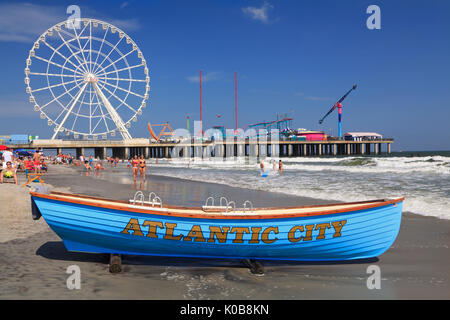 ATLANTIC CITY, NEW JERSEY - AUGUST 19, 2017: Boat lifeguard, beach and steel Pier in Atlantic City. Established in the 1800s as a health resort, today Stock Photo