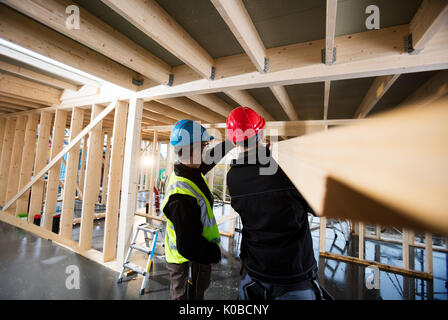 Carpenters Working At Construction Site Stock Photo