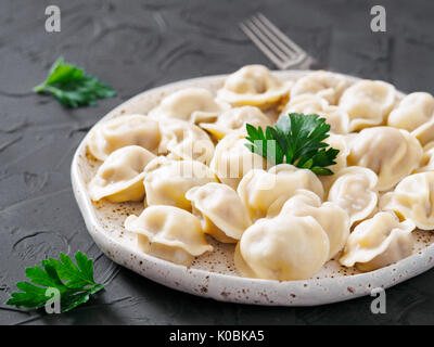 Russian pelmeni, ravioli, dumplings with meat Stock Photo