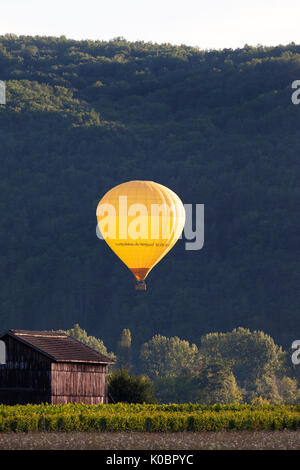 Hot Air Balloon Illuminated by the Setting Sun, Dordogne, Aquitaine, France, Europe. Stock Photo