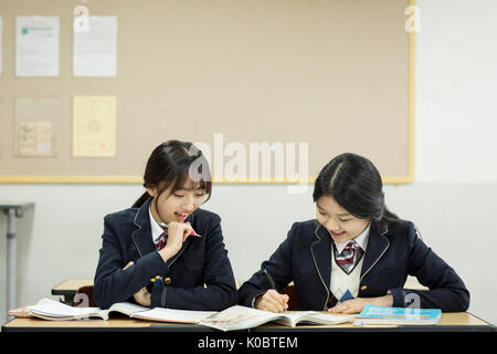 Portrait of two smiling school girls Stock Photo - Alamy