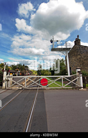 Level Crossing at Oakworth Station on the Keighley & Worth Valley Railway line in West Yorkshire. Stock Photo