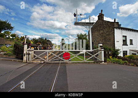 Level Crossing at Oakworth Station on the Keighley & Worth Valley Railway line in West Yorkshire. Stock Photo