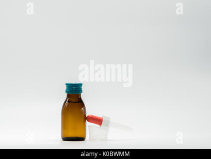 Download Medical Bottle And Measuring Plastic Cup With Medicinal Syrup On White Background Studio Photo Stock Photo Alamy Yellowimages Mockups